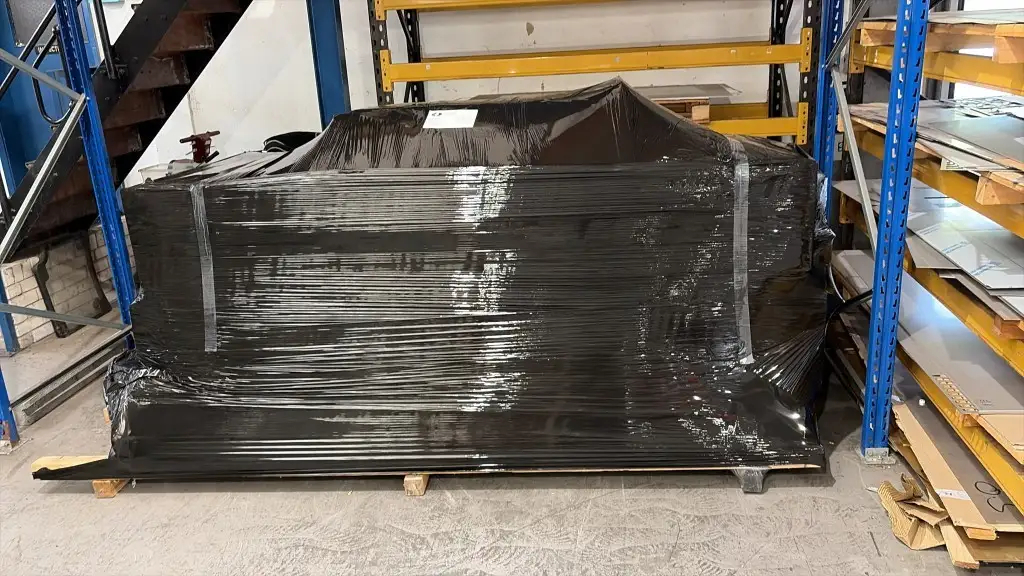 Pallet of finished fabrications stretch-wrapped, strapped and labelled in the dispatch area