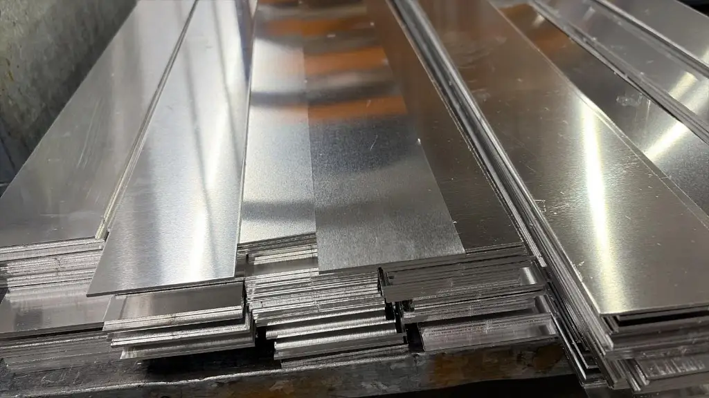 Stacks of flat laser-cut metal blanks ready for the customer to form