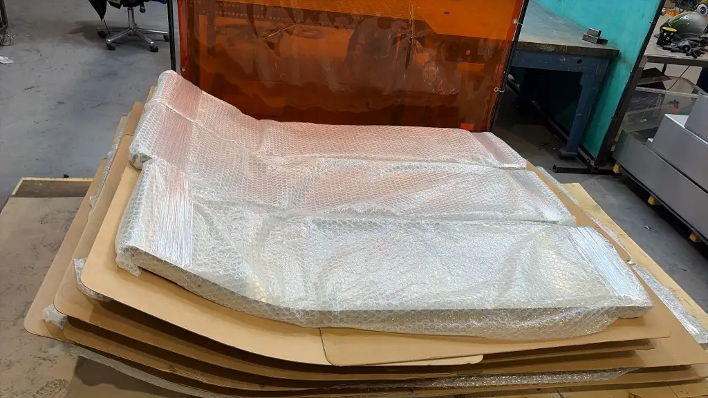 Bubble-wrapped playground slides ready for dispatch in the Wheeler Fabrications workshop